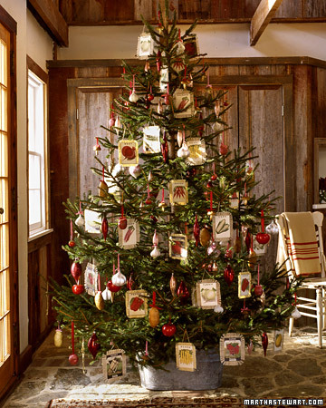 A christmas tree decorated with ornaments in a room.