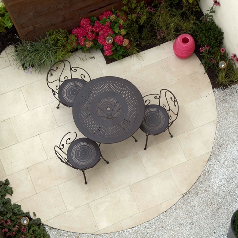 An aerial view of a patio with a table and chairs.
