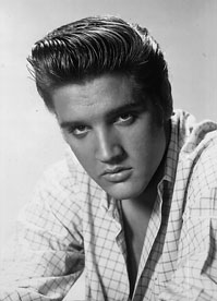 Elvis presley in a black and white photo.