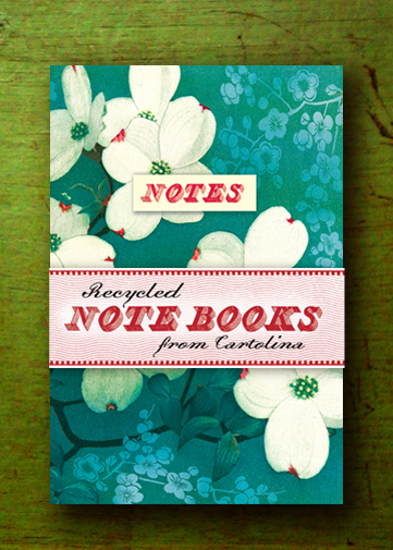 A note book with white flowers on a green background.