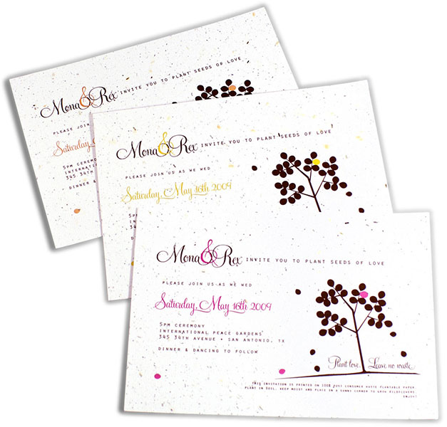 Three wedding invitations with a tree on them.