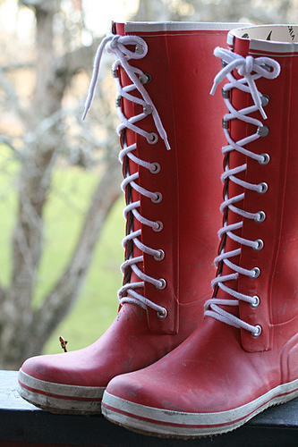 A pair of red rain boots.