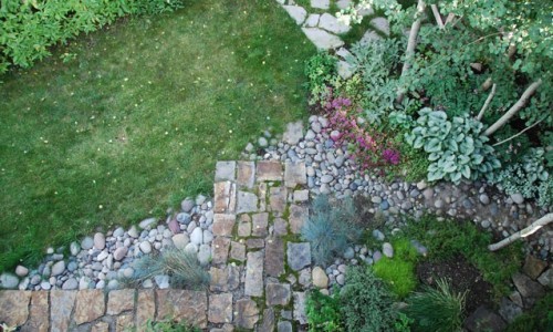 An aerial view of a stone walkway in a garden.
