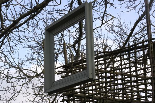 frame hanging near the treehouse to frame the view