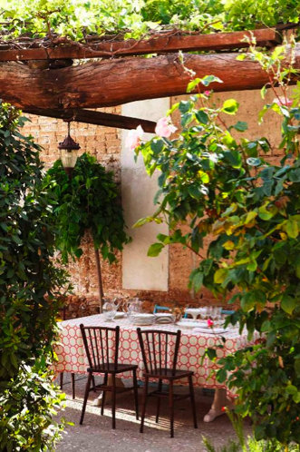 casa campo garden with rustic arbor and modern fabric