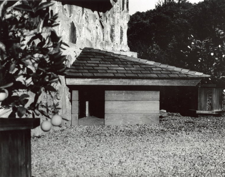 A black and white photo of a dog house.