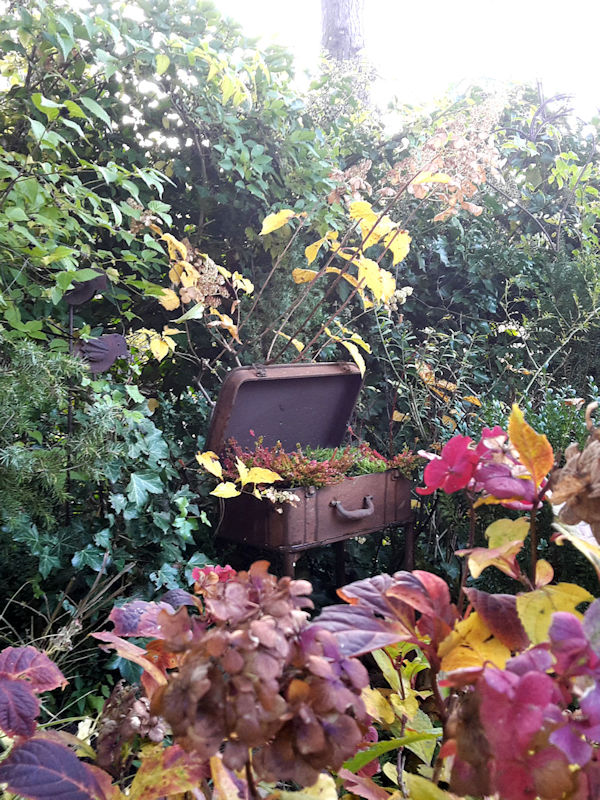 Suitcases and armchairs are decorated with autumn decoration - Austrian Garden Tour