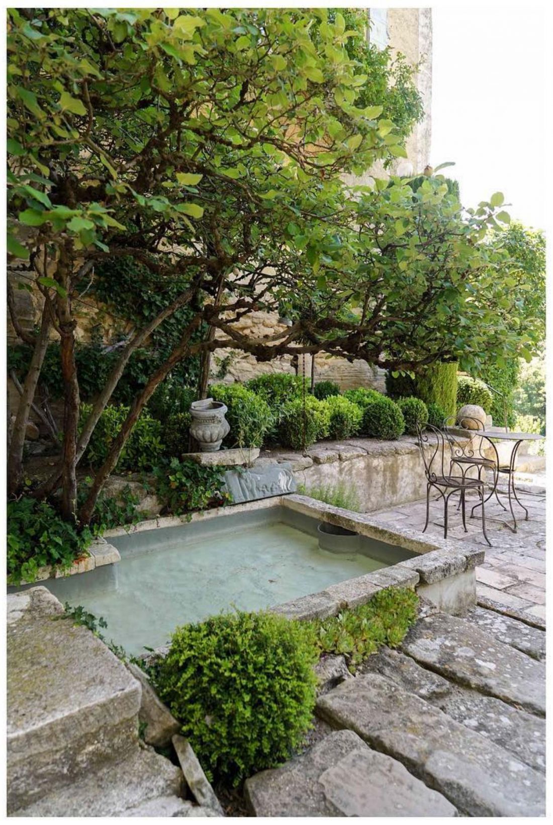 A simple dipping pool set within the limestone cliff at La Louve garden in Provence, France. image by @farlamandchandler