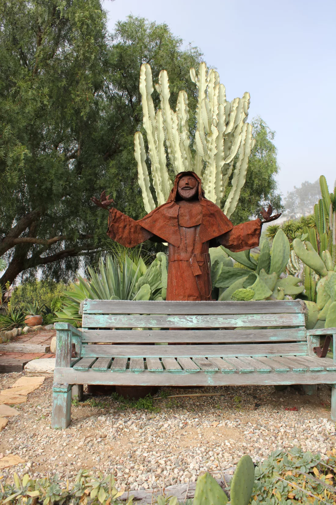 rusted sculpture in mexican garden