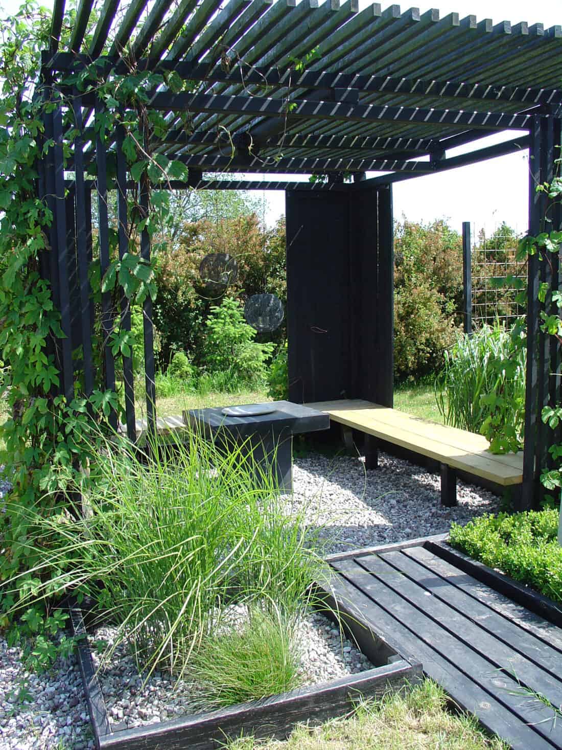 black wood finishes are typical in a garden in the Netherlands