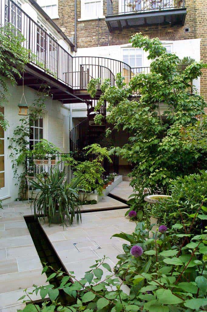 A courtyard with a spiral staircase.