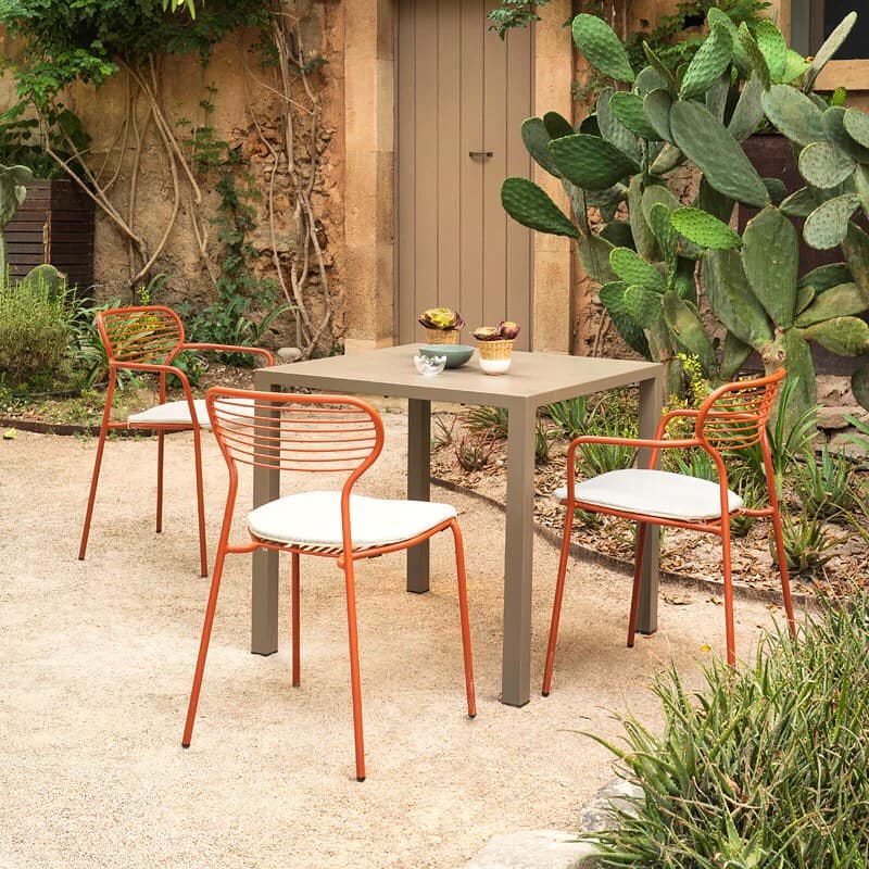 A table and chairs in an outdoor setting.