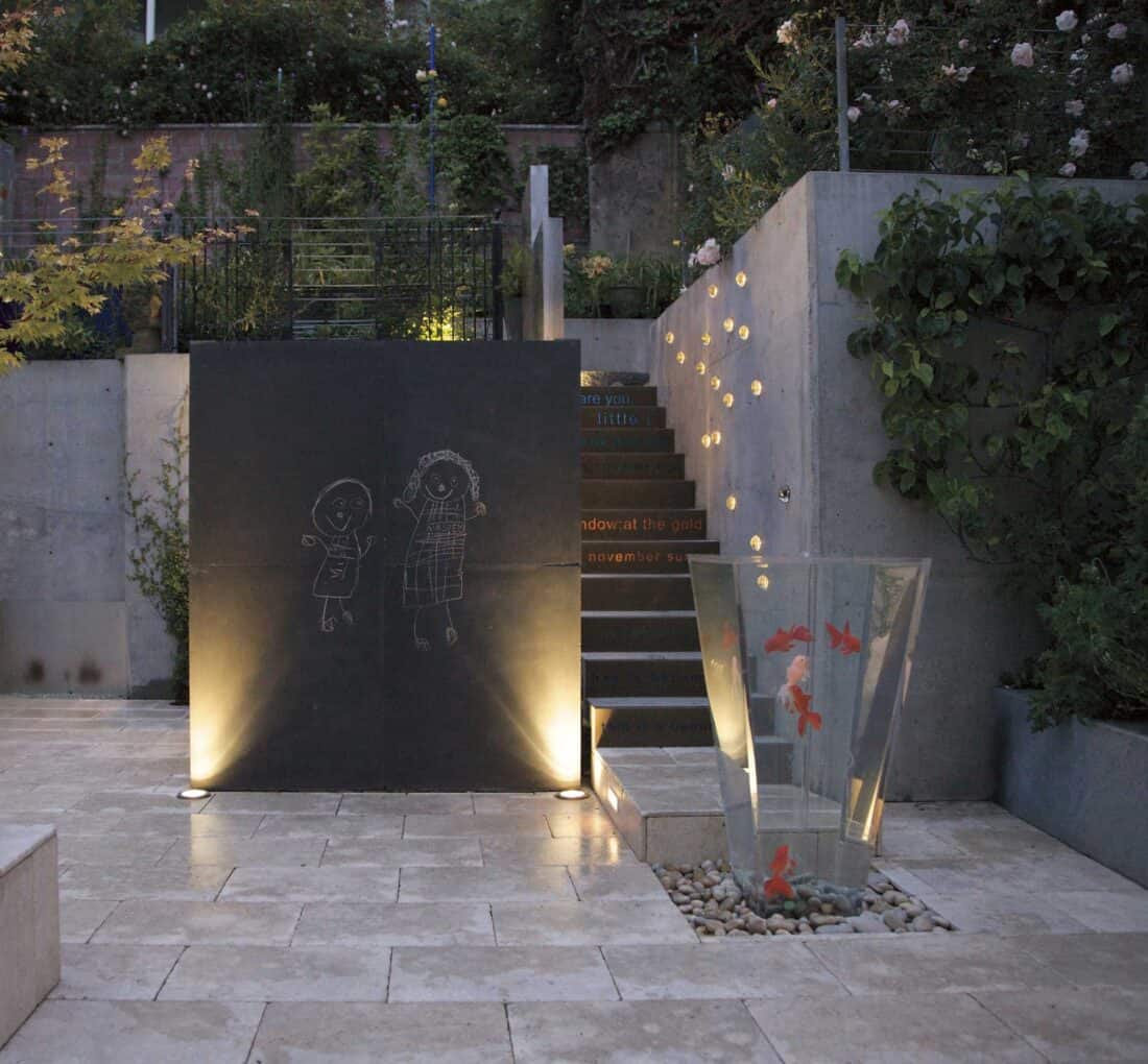 A stone wall with a fountain.