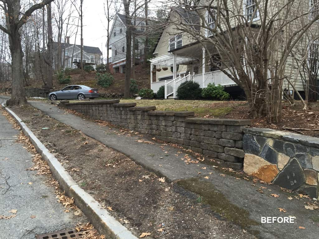 A retaining wall is being built in front of a house.