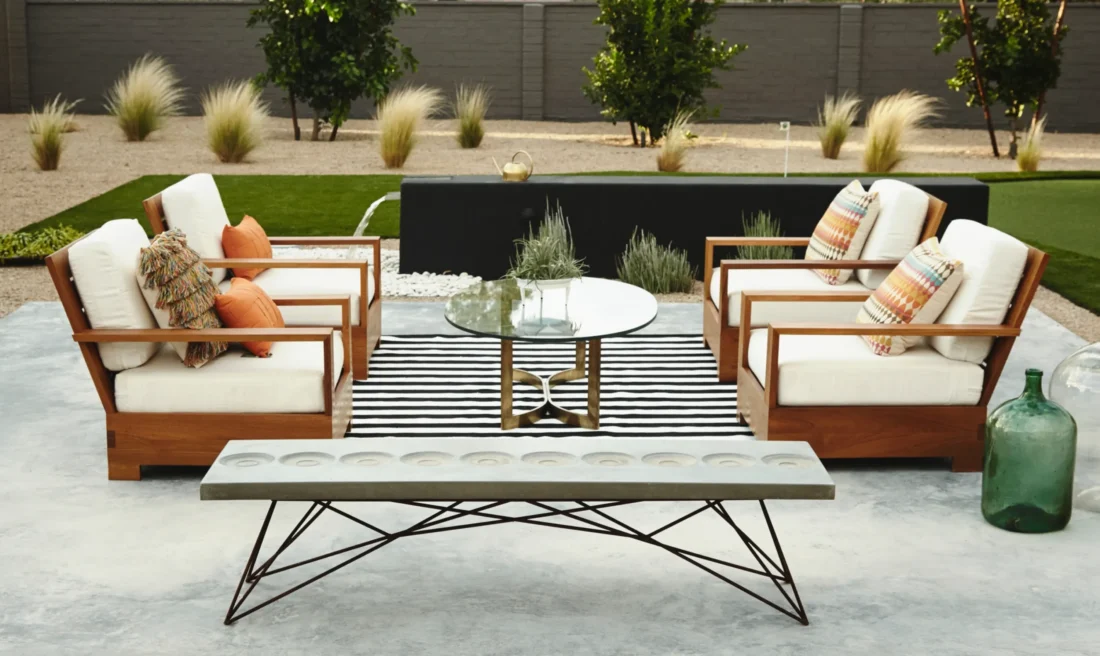 An outdoor living area with furniture and a table.