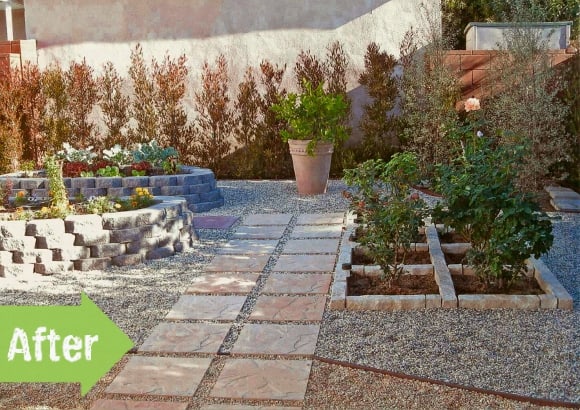 A backyard with a gravel path and plants.