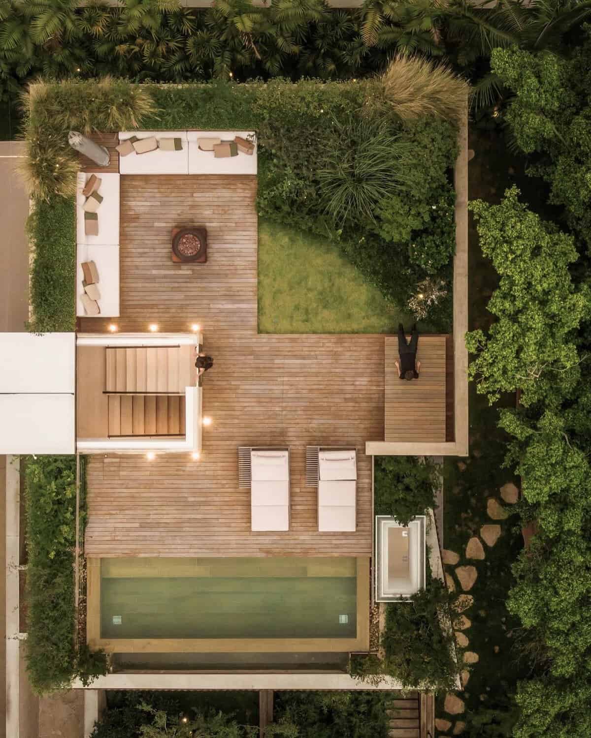 An aerial view of a house with a swimming pool.